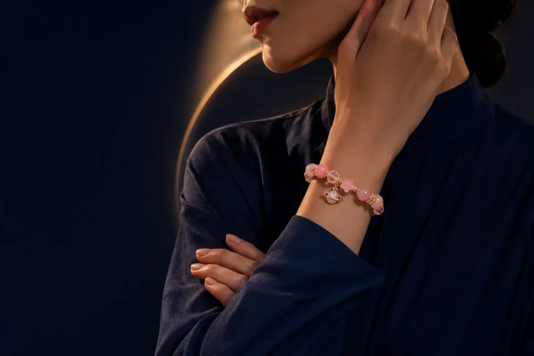 Model wearing a pink crystal bracelet in a celestial portrait for a planetary ruler crystal guide