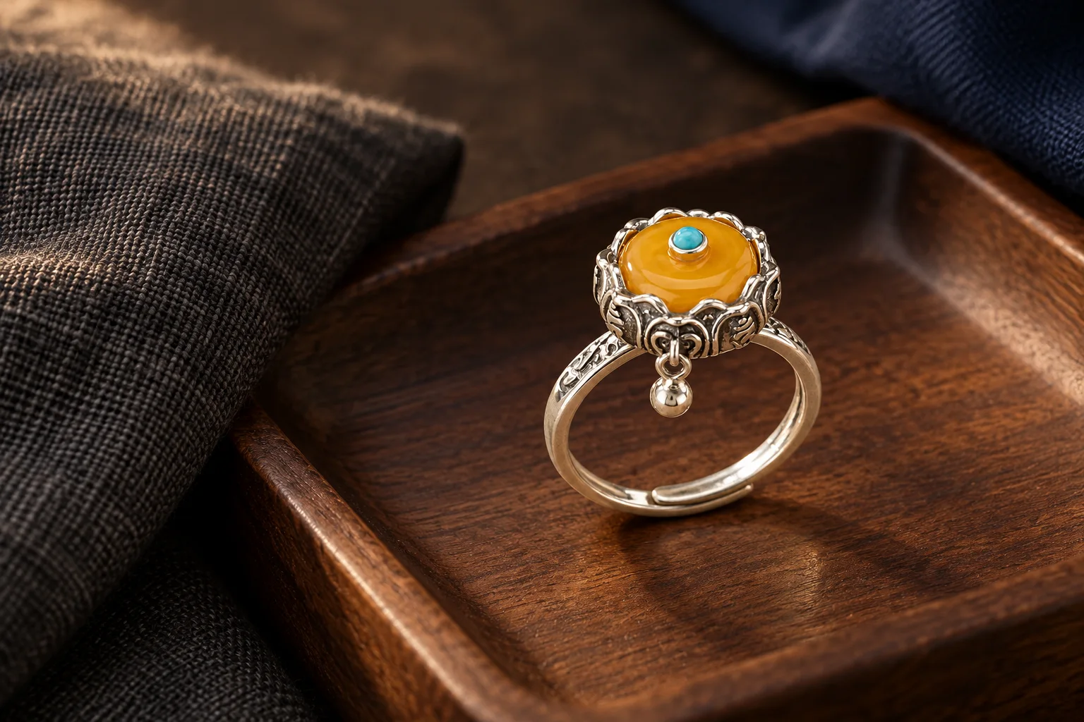Rotating prayer wheel ring on a walnut valet tray