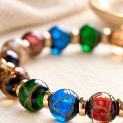 ash-glass-bead-detail-light-background Tibetan Wealth Guardian Car Charm