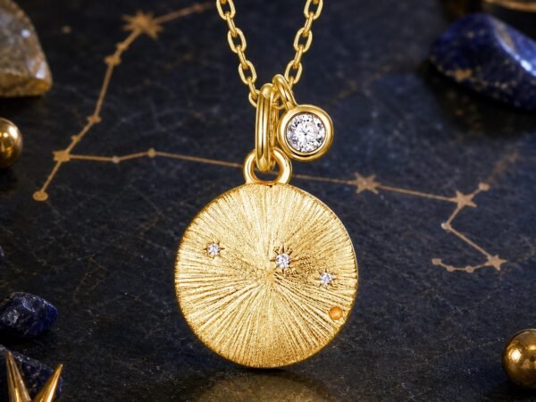 pisces-gold-zodiac-medallion-necklace-01-product Constellation medallion necklace with Pisces design and natural aquamarine accent