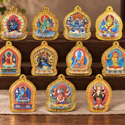 tibetan-style-painted-mini-shrine-pendant-all-styles-lifestyle-collection Mini Shrine Pendant with raised hand-painted motif, clear acrylic case, and gold-tone frame