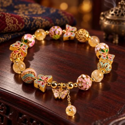 Butterfly Crystal Bracelet with golden rutilated quartz and colorful cloisonné charms